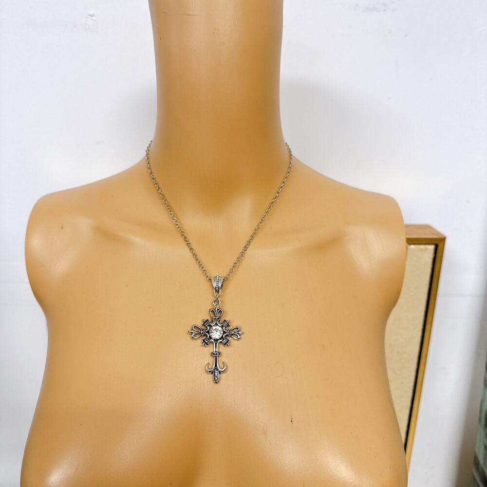 Silver‑Tone Ornate Cross Pendant Necklace with Crystal Accent